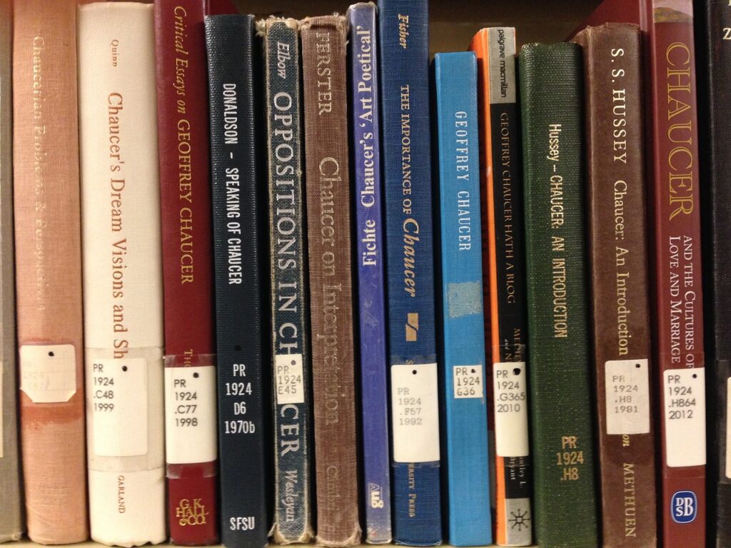 Books on a shelf with catalogue numbers on the spine