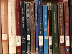 Books on a shelf with catalogue numbers on the spine