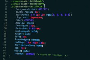 A close-up of a computer screen displaying CSS code that styles the .screen-reader-text class, showing properties like background color, border radius, box shadow, font size, padding, and positioning for hover, active, and focus states.